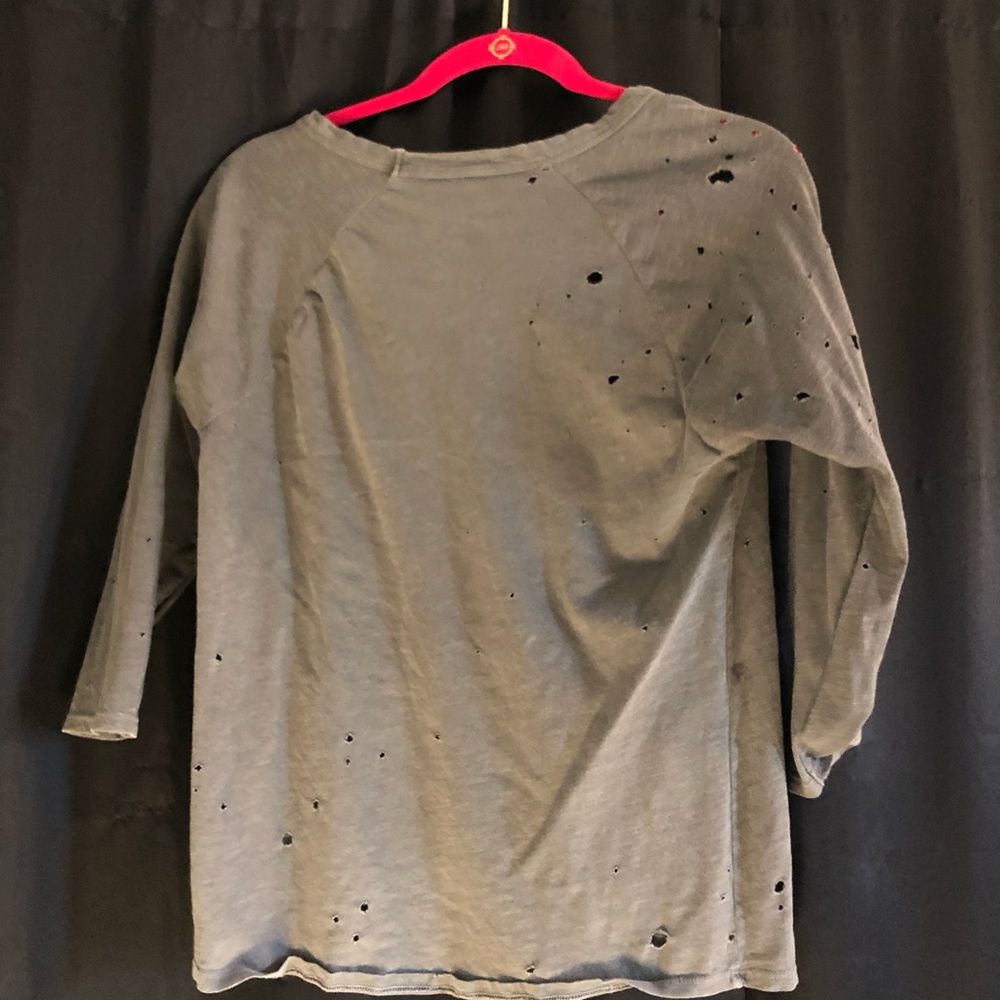 Quarter sleeve shirt with holes